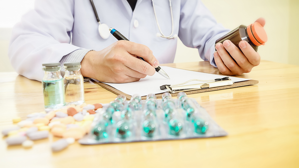 Doctor Reviewing Bioavailable Supplement Formula Ingredients  