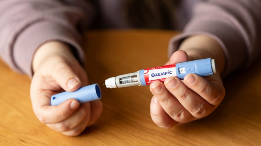 Person Holding an Ozempic injection Pen